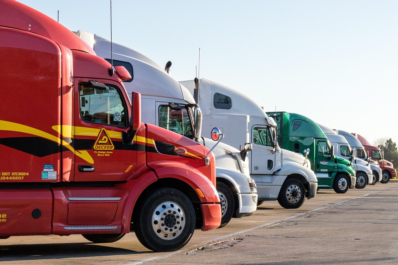 Four Semitrucks parked next to each other